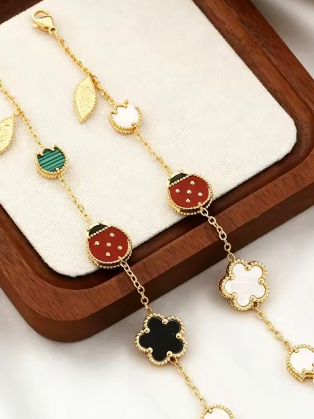 Luxury Gold-Tone Women’s Charm Necklace with Red, Black & Green Enamel Accents - Picture 3 of 4